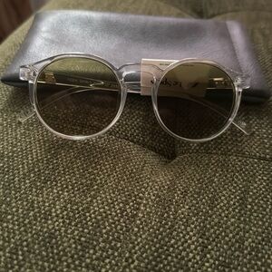 Le Specs Teen Spirit clear framed sunglasses.